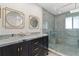 Modern bathroom with blue marble vanity and walk-in shower at 13477 Irwin Dr, Port Charlotte, FL 33953