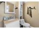 Guest bathroom with granite vanity and toilet at 13477 Irwin Dr, Port Charlotte, FL 33953