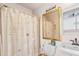 Clean bathroom with a sink, toilet and shower at 13477 Irwin Dr, Port Charlotte, FL 33953
