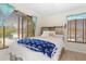 Cozy bedroom with a comfortable bed and nautical decor at 13477 Irwin Dr, Port Charlotte, FL 33953