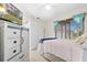 Bright bedroom with a comfortable bed and built-in dresser at 13477 Irwin Dr, Port Charlotte, FL 33953