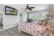 Main bedroom with a starfish comforter and large TV at 13477 Irwin Dr, Port Charlotte, FL 33953