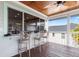 Relaxing deck with barstools, wooden flooring and water views at 13477 Irwin Dr, Port Charlotte, FL 33953