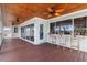 Spacious deck with ceiling fan, bar seating and water views at 13477 Irwin Dr, Port Charlotte, FL 33953