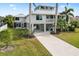 Two-story waterfront home with a metal roof and spacious yard at 13477 Irwin Dr, Port Charlotte, FL 33953
