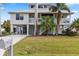 Two-story waterfront home with large yard and driveway at 13477 Irwin Dr, Port Charlotte, FL 33953