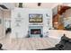 Living room fireplace with a unique mosaic tile surround at 13477 Irwin Dr, Port Charlotte, FL 33953