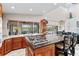 Island kitchen with granite countertops and stainless steel appliances at 13477 Irwin Dr, Port Charlotte, FL 33953