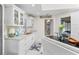 White kitchen with granite countertops and stainless steel appliances at 13477 Irwin Dr, Port Charlotte, FL 33953