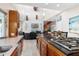 Open concept kitchen with island and view of living room at 13477 Irwin Dr, Port Charlotte, FL 33953