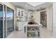 Bright kitchen features white cabinets, granite counters, and an island at 13477 Irwin Dr, Port Charlotte, FL 33953