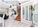 Spacious living room with a spiral staircase and fireplace at 13477 Irwin Dr, Port Charlotte, FL 33953