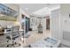 Comfortable living space with a TV, desk, and access to a balcony at 13477 Irwin Dr, Port Charlotte, FL 33953