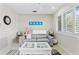 Living room features a gray couch and white coffee table at 13477 Irwin Dr, Port Charlotte, FL 33953
