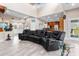 Open floor plan living room with a large sectional sofa at 13477 Irwin Dr, Port Charlotte, FL 33953