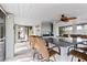 Outdoor kitchen with granite countertop and seating area at 13477 Irwin Dr, Port Charlotte, FL 33953