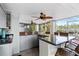 L-shaped outdoor kitchen with granite counters and cabinets at 13477 Irwin Dr, Port Charlotte, FL 33953