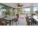 Outdoor patio with dining table and bar seating at 13477 Irwin Dr, Port Charlotte, FL 33953