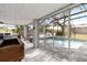 Covered patio with pool access and bar area at 13477 Irwin Dr, Port Charlotte, FL 33953