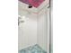 Small shower stall with hexagon tile floor and white tiled walls at 13477 Irwin Dr, Port Charlotte, FL 33953