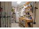Basement workshop with workbench, tools, and storage shelves at 13477 Irwin Dr, Port Charlotte, FL 33953