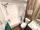 Clean bathroom with tub, shower and gray vanity at 1400 Tarpon Woods Blvd # H6, Palm Harbor, FL 34685