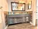 Modern bathroom with double vanity and wood-look floors at 1400 Tarpon Woods Blvd # H6, Palm Harbor, FL 34685