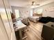 Bedroom with two beds, wood-look floors, and ceiling fan at 1400 Tarpon Woods Blvd # H6, Palm Harbor, FL 34685