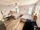 Bedroom with two beds, wood-look floors, and ceiling fan at 1400 Tarpon Woods Blvd # H6, Palm Harbor, FL 34685