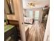 Bedroom with wood-look floors, and a ceiling fan, view from doorway at 1400 Tarpon Woods Blvd # H6, Palm Harbor, FL 34685