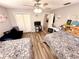 Spacious bedroom with two beds, a desk, and wood-look floors at 1400 Tarpon Woods Blvd # H6, Palm Harbor, FL 34685