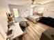 Bedroom with two beds, wood-look floors, and ceiling fan at 1400 Tarpon Woods Blvd # H6, Palm Harbor, FL 34685