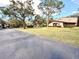 Gated community with lush landscaping and pond at 1400 Tarpon Woods Blvd # H6, Palm Harbor, FL 34685