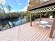 Gazebo with table and chairs overlooking a pond at 1400 Tarpon Woods Blvd # H6, Palm Harbor, FL 34685