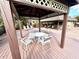 Covered gazebo on the deck with seating for guests at 1400 Tarpon Woods Blvd # H6, Palm Harbor, FL 34685