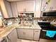 Well-equipped kitchen with granite countertops and modern cabinetry at 1400 Tarpon Woods Blvd # H6, Palm Harbor, FL 34685