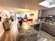 Open concept kitchen with granite countertops, offering a view of the living room at 1400 Tarpon Woods Blvd # H6, Palm Harbor, FL 34685