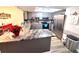 Updated kitchen featuring granite countertops and stainless steel appliances at 1400 Tarpon Woods Blvd # H6, Palm Harbor, FL 34685