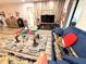 Living room with wood-look floors, a TV, and comfortable seating at 1400 Tarpon Woods Blvd # H6, Palm Harbor, FL 34685