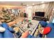 Spacious living room with comfy sofas and a large TV at 1400 Tarpon Woods Blvd # H6, Palm Harbor, FL 34685