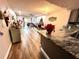 Open living room and kitchen area with hardwood floors at 1400 Tarpon Woods Blvd # H6, Palm Harbor, FL 34685