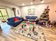Comfortable living room featuring two sofas and a Christmas tree at 1400 Tarpon Woods Blvd # H6, Palm Harbor, FL 34685
