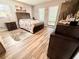 Main bedroom with light flooring and large windows at 1400 Tarpon Woods Blvd # H6, Palm Harbor, FL 34685