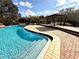 Curved pool with deck and gazebo at 1400 Tarpon Woods Blvd # H6, Palm Harbor, FL 34685