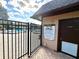 Gated entrance to community pool area at 1400 Tarpon Woods Blvd # H6, Palm Harbor, FL 34685