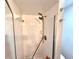 Clean shower with white tile and a modern shower head at 1400 Tarpon Woods Blvd # H6, Palm Harbor, FL 34685