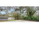 Large backyard with sheds and lush landscaping at 14927 Balough Rd, Odessa, FL 33556