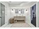 Double vanity bathroom with modern finishes and a spacious shower at 16403 Zurraquin De Avila, Tampa, FL 33613