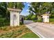 Gated entrance to Avila community with brick pavers and landscaping at 16403 Zurraquin De Avila, Tampa, FL 33613