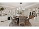 Elegant dining room with round table and woven chairs at 16403 Zurraquin De Avila, Tampa, FL 33613